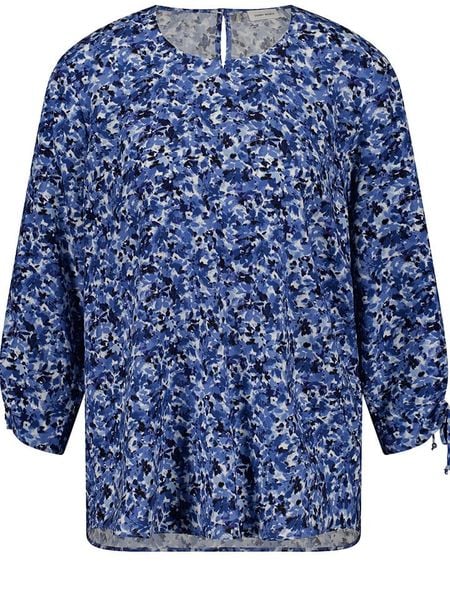 Gerry Weber Bluzka w kolorze niebieskim rozmiar: 36. Niebieskie bluzki Gerry Weber, bez wzorów, z wiskozy, bez kołnierzyka, bez ramiączek. Za 101.23 zł.