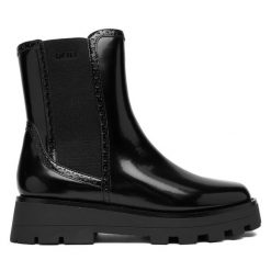 Sztyblety DKNY. Czarne botki DKNY, bez wzorów, bez obcasa, na płaskiej podeszwie, bez zapięcia. Za 439.99 zł.