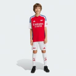 Szorty Arsenal 24/25 Home Kids. Białe szorty adidas, bez wzorów, z materiału, sportowe. W wyprzedaży za 143.20 zł.