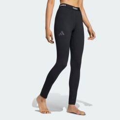 LEGGINSY BAZOWE TERREX MULTI SYNTHETIC. Czarne legginsy adidas, bez wzorów, z dzianiny, eleganckie. Za 219.00 zł.