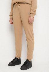 Beżowe Spodnie Dresowe z Ozdobą z Boku Rialane. Brązowe jeansy Born2be, plus size, z aplikacjami, z dresówki, eleganckie. Za 59.99 zł.