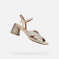 Sandały GEOX D GENZIANA MID Złoty. Szare sandały Geox, bez wzorów, ze skóry, bez obcasa, bez zapięcia. Za 471.99 zł.