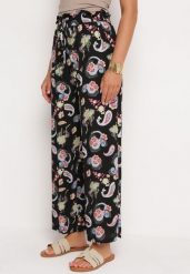 Czarno-Różowe Spodnie z Bawełny z w Stylu Boho z Szerokimi Nogawkami i Gumką w Talii Jelvia. Czarne jeansy Born2be, na lato, l, bez wzorów, z bawełny, boho. Za 59.99 zł.