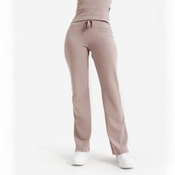 Rozszerzane legginsy damskie Elementals. Brązowe legginsy Decathlon, bez wzorów, z bawełny, eleganckie. Za 89.99 zł.