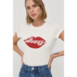 Guess t-shirt bawełniany kolor beżowy. Brązowe t-shirty Guess, l, z aplikacjami, z bawełny, bez kołnierzyka, bez ramiączek. Za 279.99 zł.