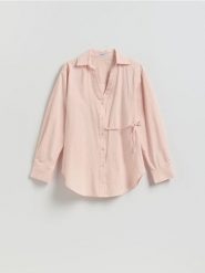 Bawełniana koszula z wiązaniem - brzoskwiniowy. Pomarańczowe koszule Reserved, l, bez wzorów, z bawełny, bez kołnierzyka, bez ramiączek. Za 129.99 zł.