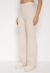 Jasnobeżowe Prążkowane Spodnie z Wełną o Szerokim Kroju z Wysokim Stanem Reinnia. Brązowe spodnie materiałowe Born2be, bez wzorów, z jeansu, z podwyższonym stanem. Za 79.99 zł.