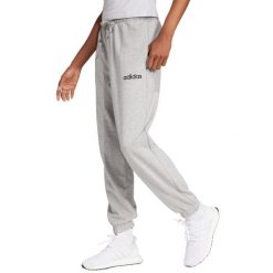 Damskie spodnie dresowe adidas Essentials Linear French Terry Cuffed. Szare spodnie dresowe adidas, bez wzorów, z bawełny. Za 157.99 zł.