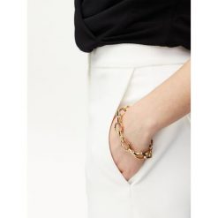 Bransoletka Guess. Żółte bransoletki Guess, złote. Za 389.99 zł.