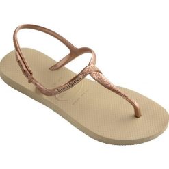 Klapki Havaianas Model 4144756 Kolor Brąz. Brązowe klapki Havaianas, bez wzorów, z gumy, sportowe, bez obcasa, bez zapięcia. Za 69.99 zł.