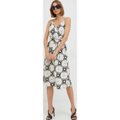 Morgan sukienka kolor beżowy mini rozkloszowana. Brązowe sukienki Morgan, na co dzień, bez wzorów, bez kołnierzyka, bez ramiączek, mini, proste. Za 409.99 zł.