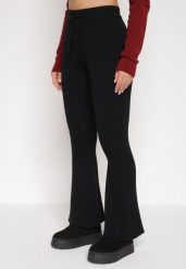 Czarne Spodnie z Wiskozą i Wysokim Stanem Typu Dzwony Tusvira. Czarne jeansy Born2be, l, bez wzorów, z jeansu, eleganckie, z podwyższonym stanem. Za 129.99 zł.