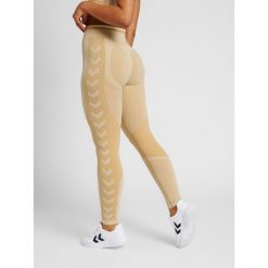Legginsy damskie Hummel MT Lulu. Brązowe legginsy sportowe Hummel, bez wzorów, z dzianiny, na jogę i pilates. W wyprzedaży za 172.00 zł.