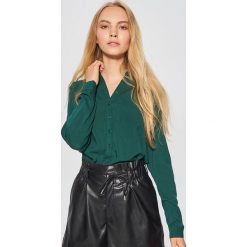 Gładka koszula - Khaki. Koszule marki QUECHUA. W wyprzedaży za 39.99 zł.