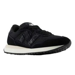 Trampki Damskie Skóra 237. Czarne trampki New Balance, bez wzorów, z gumy, bez zapięcia. Za 587.99 zł.