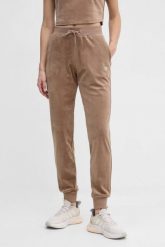 GUESS Brązowe damskie spodnie welurowe Couture. Brązowe spodnie dresowe Guess, z aplikacjami, z dresówki. W wyprzedaży za 268.99 zł.