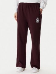 Tommy Hilfiger Spodnie dresowe UW0UW06081 Bordowy Wide Leg. Czerwone spodnie dresowe Tommy Hilfiger, bez wzorów, z bawełny. Za 279.99 zł.
