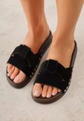 Czarne Klapki z Przekładanymi Paskami i Ozdobnymi Nitami Talysha. Czarne klapki Renee, bez wzorów, z koronki, eleganckie, bez obcasa, na płaskiej podeszwie, bez zapięcia. Za 79.99 zł.