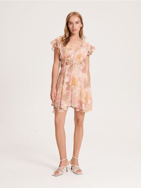 Wzorzysty kombinezon - wielobarwny. Kombinezony Reserved, l, bez wzorów, z tkaniny, bez kołnierzyka, bez ramiączek. W wyprzedaży za 49.99 zł.