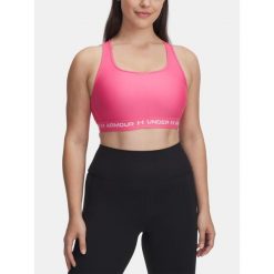 Biustonosz do jogi i pilatesu damski Under Armour Mid Crossback. Czerwone biustonosze sportowe Under Armour, bez wzorów, na fitness i siłownię. W wyprzedaży za 139.99 zł.