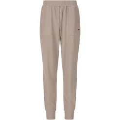 Damskie spodnie dresowe Athlecia Reiley. Brązowe spodnie dresowe Athlecia, bez wzorów, z dresówki, sportowe. Za 251.50 zł.