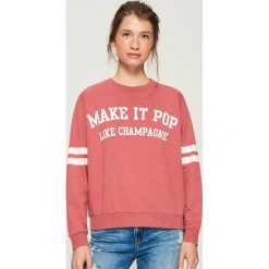 Dzianinowa bluza z nadrukiem - Pomarańczo. Bluzy bez kaptura marki Sinsay. Za 29.99 zł.