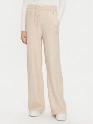 Tommy Hilfiger Spodnie dzianinowe UW0UW05523 Beżowy Relaxed Fit. Brązowe spodnie materiałowe Tommy Hilfiger, bez wzorów, z dzianiny. Za 239.99 zł.