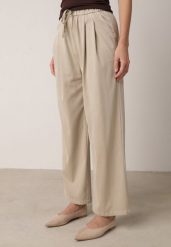 Beżowe Szerokie Spodnie z Bawełną Wiskozą Gumką w Pasie i Sznurkiem Iridara. Brązowe jeansy Born2be, m, bez wzorów, z bawełny, eleganckie, z podwyższonym stanem. Za 74.99 zł.
