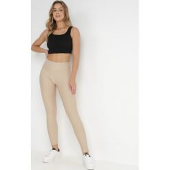 Beżowe Legginsy Mirny. Brązowe legginsy Born2be, bez wzorów, długie. W wyprzedaży za 69.99 zł.