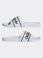 Adidas Klapki w kolorze białym rozmiar: 43. Białe klapki adidas, bez wzorów, klasyczne, z otwartym noskiem, bez obcasa, bez zapięcia. Za 142.53 zł.