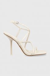 Dkny sandały skórzane REIA kolor beżowy K4261929. Brązowe sandały DKNY, bez wzorów, z materiału, bez obcasa, na obcasie, bez zapięcia. Za 679.99 zł.