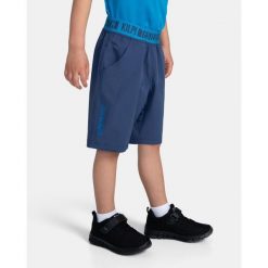 Pantaloncini da ragazzo Kilpi JOSEPH-JB. Niebieskie szorty Kilpi, bez wzorów, sportowe. Za 91.56 zł.