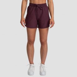 Szorty damskie fitness regular z kieszeniami bakłażanowe TRN. Czerwone szorty sportowe GYMBEAM, bez wzorów, z elastanu, do biegania. Za 73.90 zł.
