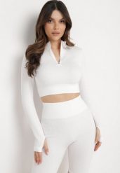Biała Bluzka Zapinana na Suwak z Wycięciem przy Ściągaczu Aisllain. Białe bluzki Born2be, bez wzorów, eleganckie, bez kołnierzyka, bez ramiączek. Za 29.99 zł.