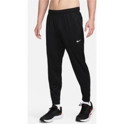 Spodnie sportowe damskie Nike Totality. Czarne spodnie dresowe Nike, bez wzorów, z dresówki, długie. Za 381.00 zł.