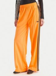 Adidas Spodnie dresowe adicolor Classic Firebird JY2694 Żółty Loose Fit. Żółte spodnie dresowe adidas, bez wzorów, z dresówki. Za 219.99 zł.
