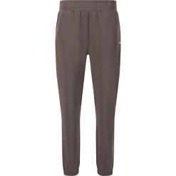 Damskie spodnie dresowe Athlecia Jillnana V2. Czarne spodnie sportowe Athlecia, bez wzorów, z dresówki, na fitness i siłownię. Za 256.50 zł.