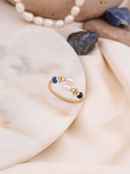 Pierres de Jade Pozłacany pierścionek z perłą i kryształami rozmiar: onesize. Białe pierścionki Pierres de Jade, z kryształem, pozłacane. Za 26.99 zł.