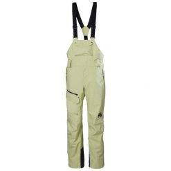 Damski kombinezon narciarski Helly Hansen. Żółte kombinezony Helly Hansen, na zimę, bez wzorów, sportowe, bez kołnierzyka, bez ramiączek. Za 1,306.50 zł.