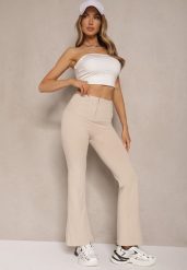 Beżowe Spodnie Dzwony High Waist Odavia. Brązowe jeansy Renee, bez wzorów, z jeansu, eleganckie, z podwyższonym stanem. W wyprzedaży za 55.99 zł.
