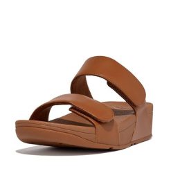 Skórzane sandały dla kobiet FitFlop Lulu Adjustable. Czarne sandały FIT FLOP, bez wzorów, z materiału, eleganckie, bez obcasa, bez zapięcia. Za 483.50 zł.