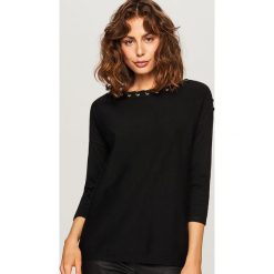 Sweter z ozdobnym wiązaniem - Czarny. Swetry marki DOMYOS. W wyprzedaży za 59.99 zł.