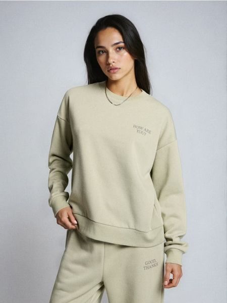 Bluza crewneck z napisem - niebieski. Niebieskie bluzy Sinsay, l, bez wzorów, bez ramiączek, bez kaptura. Za 29.99 zł.