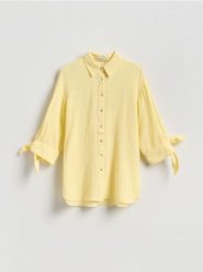 Muślinowa koszula - jasnożółty. Żółte koszule Reserved, l, bez wzorów, z bawełny, bez kołnierzyka, bez ramiączek. Za 109.99 zł.