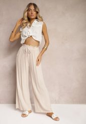 Jasnobeżowe Spodnie z Bawełny Typu Palazzo High Waist z Gumką w Talii Nelsaria. Brązowe jeansy Renee, bez wzorów, z bawełny, eleganckie, z podwyższonym stanem. W wyprzedaży za 35.99 zł.