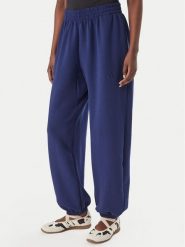Adidas Spodnie dresowe Soft Lux KS7879 Niebieski Loose Fit. Niebieskie spodnie dresowe adidas, bez wzorów, z dresówki. Za 329.99 zł.