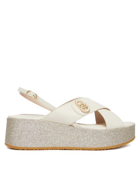 Liu Jo Sandały Flo 03 SA6141 PX106 Biały. Białe sandały Liu Jo, bez wzorów, ze skóry, bez obcasa, na koturnie, bez zapięcia. Za 639.99 zł.