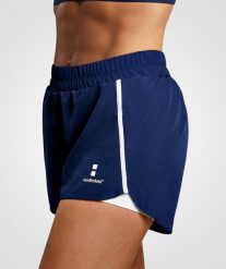 Spodenki do Tenis/Padel damskie Training. Niebieskie szorty sportowe NORDICDOTS, bez wzorów, z materiału, z standardowym stanem, na fitness i siłownię. Za 190.00 zł.