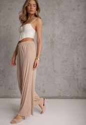 Beżowe Szerokie Spodnie High Waist z Prążkowanej Tkaniny z Ozdobnym Guzikiem Dalifa. Brązowe jeansy Renee, l, bez wzorów, z jeansu, glamour, z podwyższonym stanem, krótkie. Za 59.99 zł.