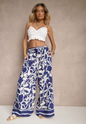 Niebieskie Spodnie o Szerokim Kroju High Waist w Kwiaty Nelrive. Niebieskie jeansy Renee, z aplikacjami, z jeansu, eleganckie, z podwyższonym stanem. W wyprzedaży za 35.99 zł.
